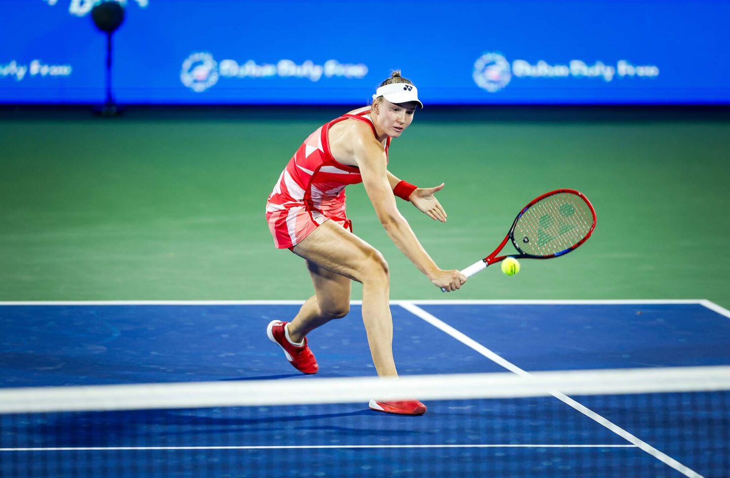 Elena Rybakina returning the ball during her match at Dubai 2025