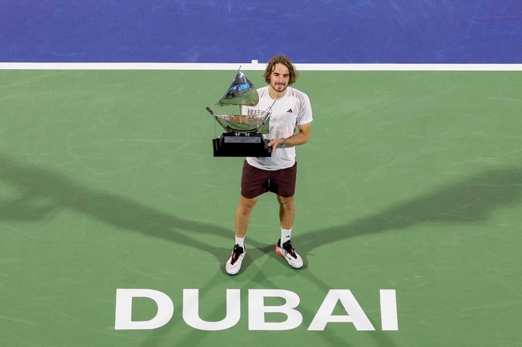 Stefanos Tsitsipas holds the trophy after winning the 2025 Dubai Duty Free Tennis Championships