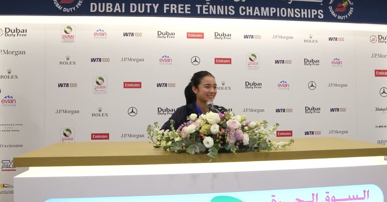 Eala sitting at the press table ready for her interview