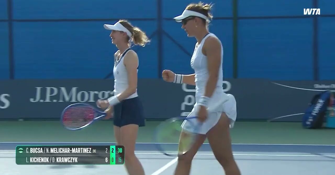 WTA doubles players look pleased after a match point