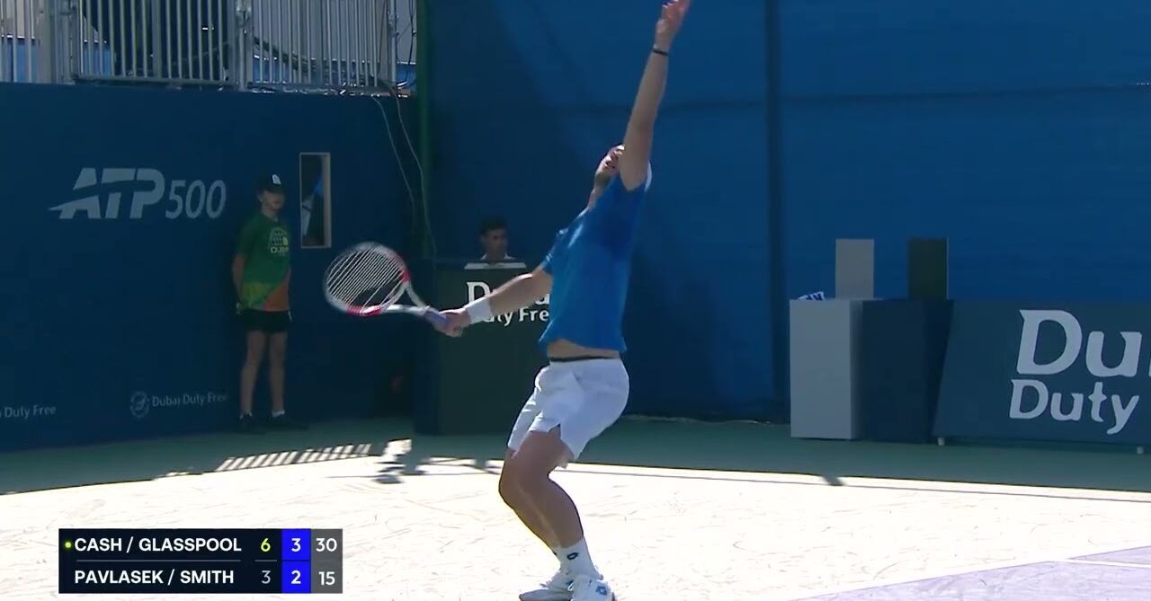 Lloyd Glasspool serves during the 2nd round doubles tournament at the 2026 Dubai Duty Free Tennis Championships